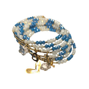 Rubylishious 
Handmade memory wire bead bracelet 
With gold charms 
One size
Whi